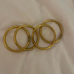 Four BuddhaGirl bracelets gold.